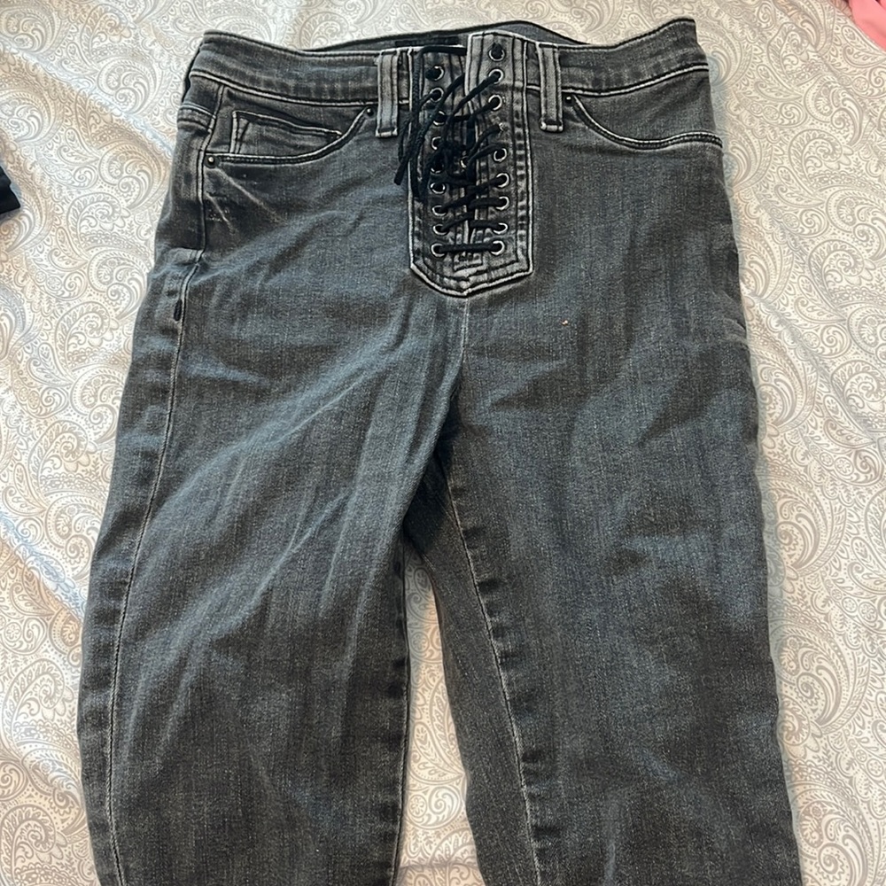 Grey lace up skinny jeans